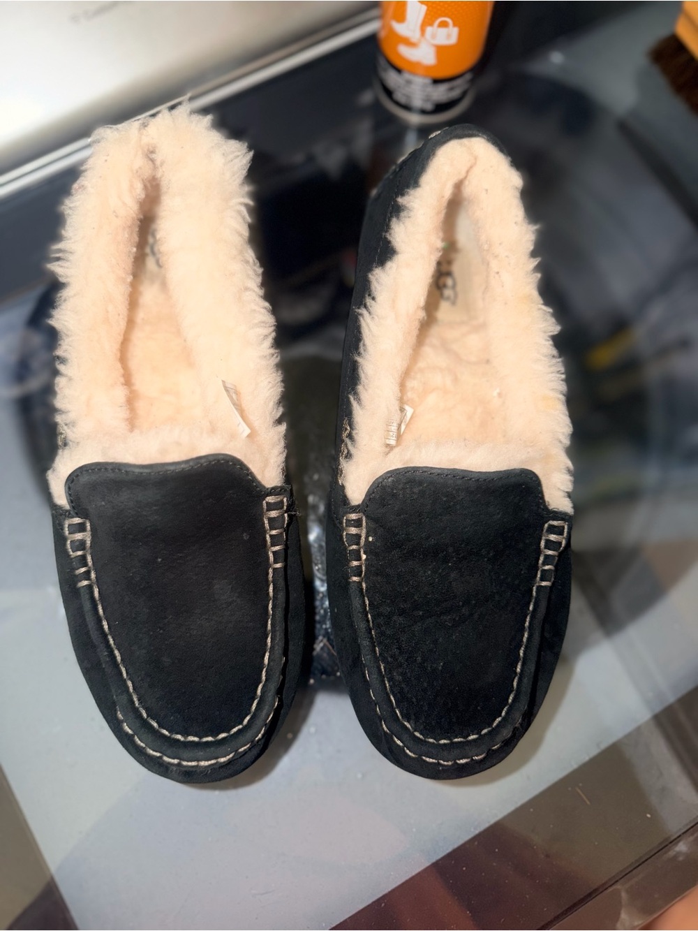 UGG Black Moccasin Slippers with Cream Shearling Lining